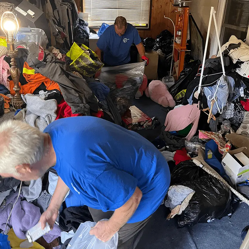 The Wemove-it.com team performing hoarding cleaning services.